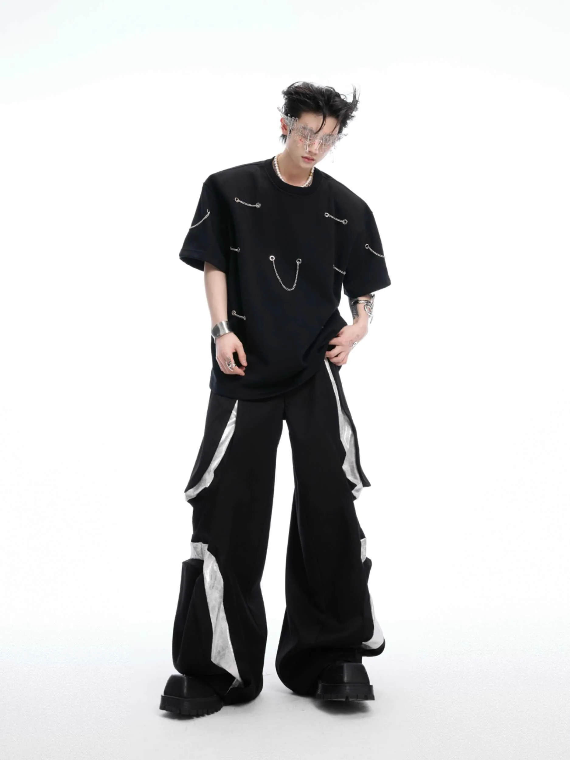 Black heavy cotton t-shirt with metal chain padded shoulder detail, round neck, short sleeves