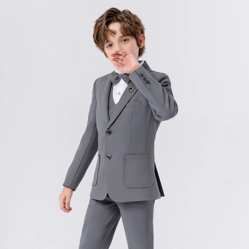 Boys British solid colour suit dress set with single-breasted jacket, long sleeves, vest, bow tie, and brooch in beige blue or gray