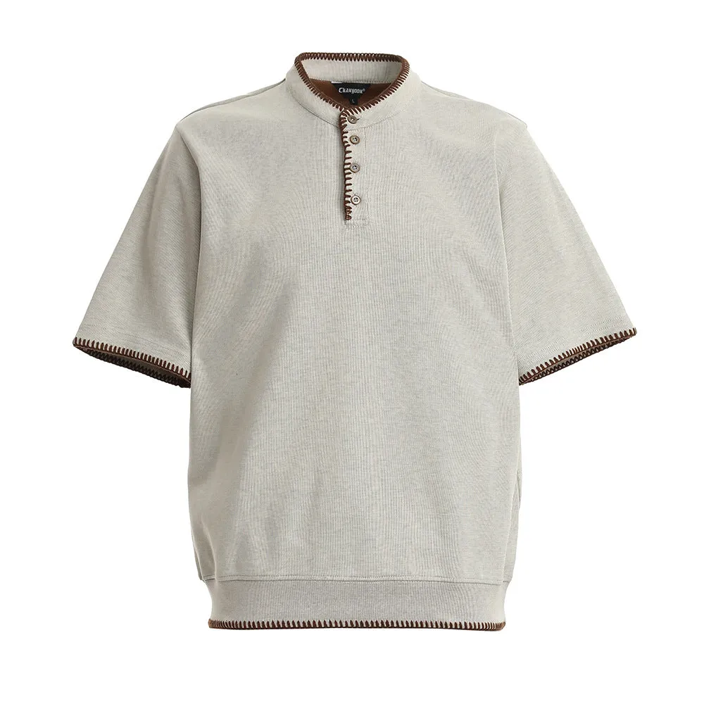 Men's short-sleeved polo shirt in cotton with loose fit, light gray colour, front view
