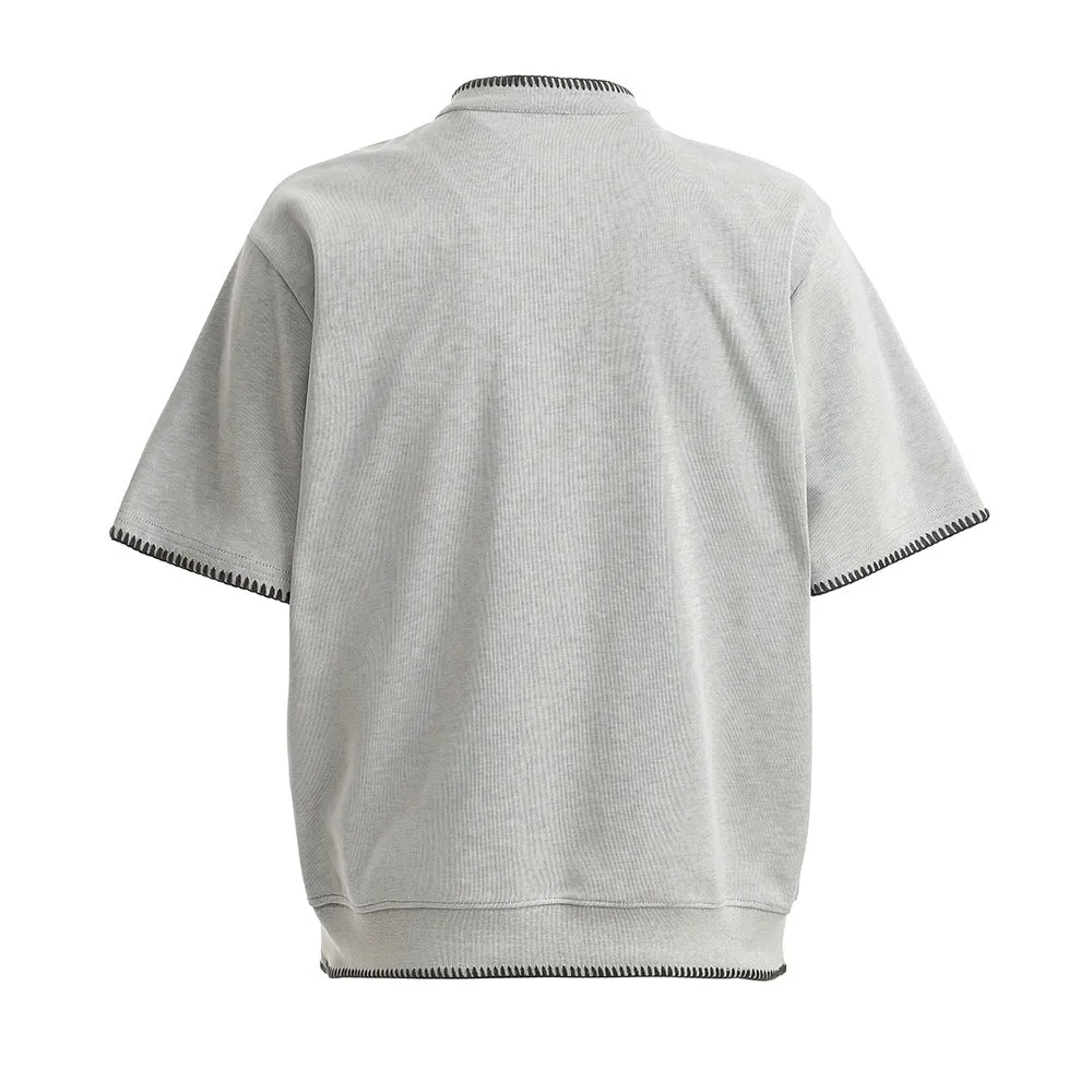 Men's short-sleeved polo shirt in cotton with loose fit, light gray colour, front view