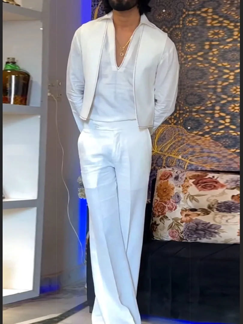 White three-piece women's outfit with V-neck shirt, sleeveless vest, and full-length trousers