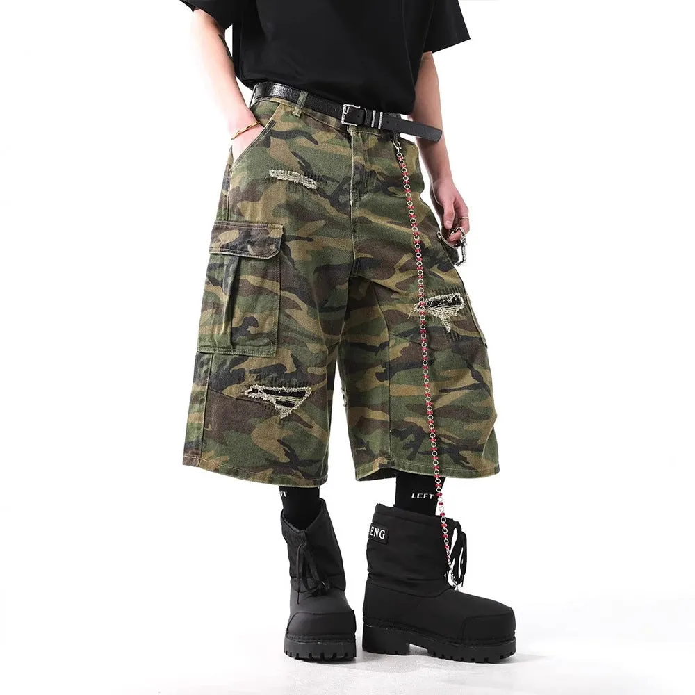 Men's straight-leg cropped trousers in a green and brown camouflage pattern, made from cotton denim.
