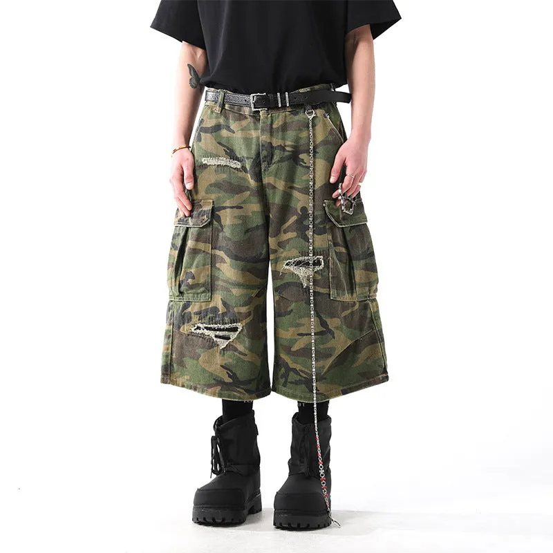 Men's straight-leg cropped trousers in a green and brown camouflage pattern, made from cotton denim.