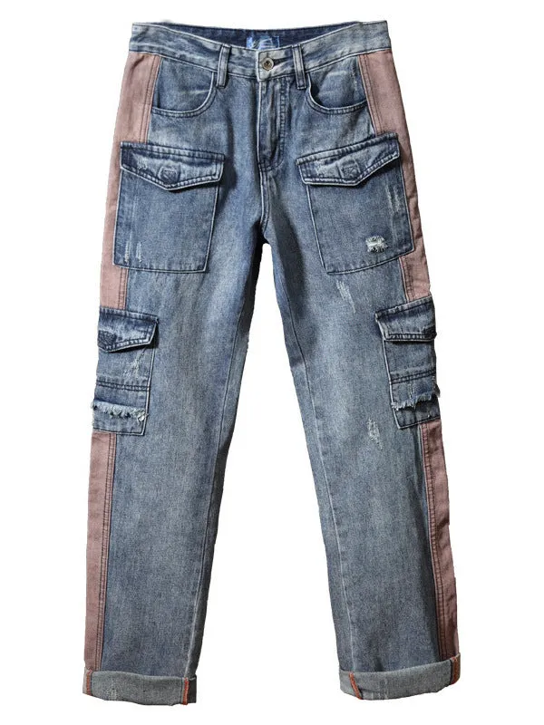 Man wearing loose-fit blue denim hip hop trousers with multiple pockets and a straight leg.