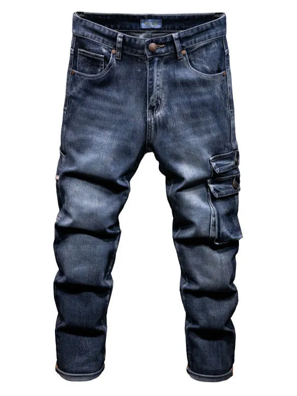 Man wearing loose-fit blue denim hip hop trousers with multiple pockets and a straight leg.