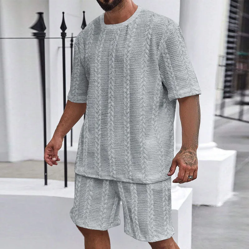 Men's wheat grain tassel knit two-piece set: grey hooded sweatshirt and matching shorts, front view on model