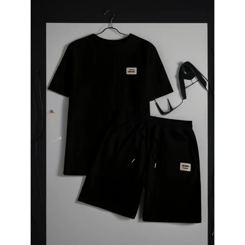 Men's wheat grain tassel knit two-piece set: grey hooded sweatshirt and matching shorts, front view on model