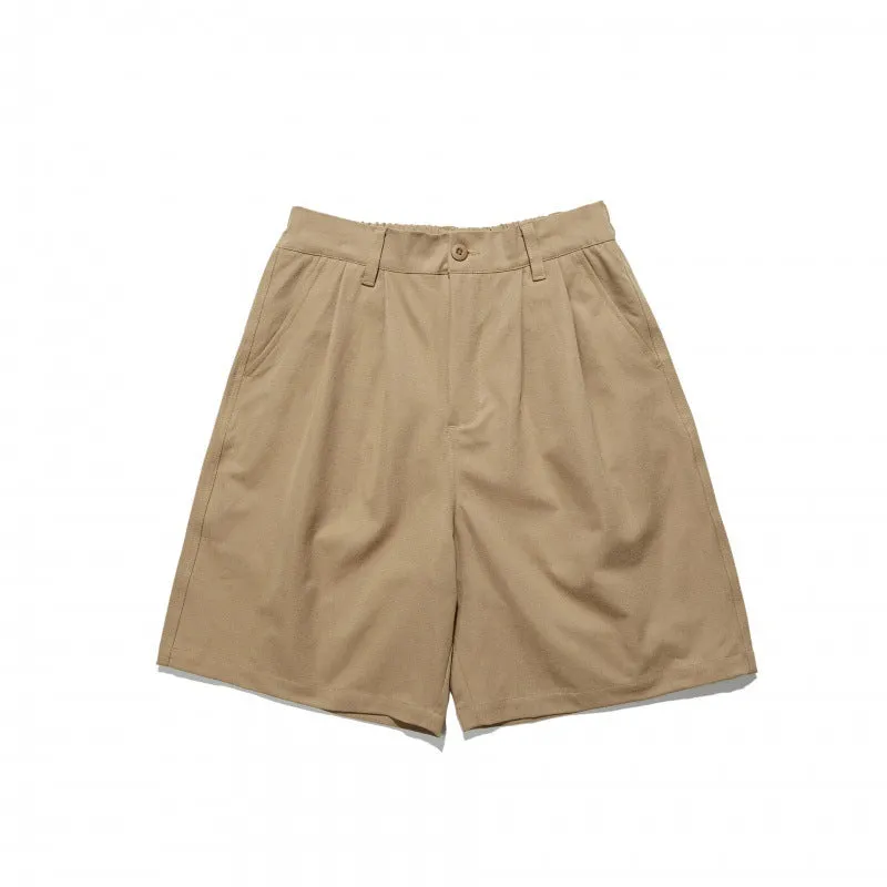 Loose straight drooping suit shorts in light grey, front view, with micro-elastic waist and retro style