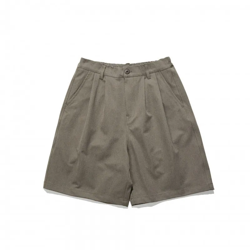 Loose straight drooping suit shorts in light grey, front view, with micro-elastic waist and retro style