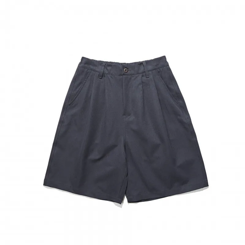Loose straight drooping suit shorts in light grey, front view, with micro-elastic waist and retro style