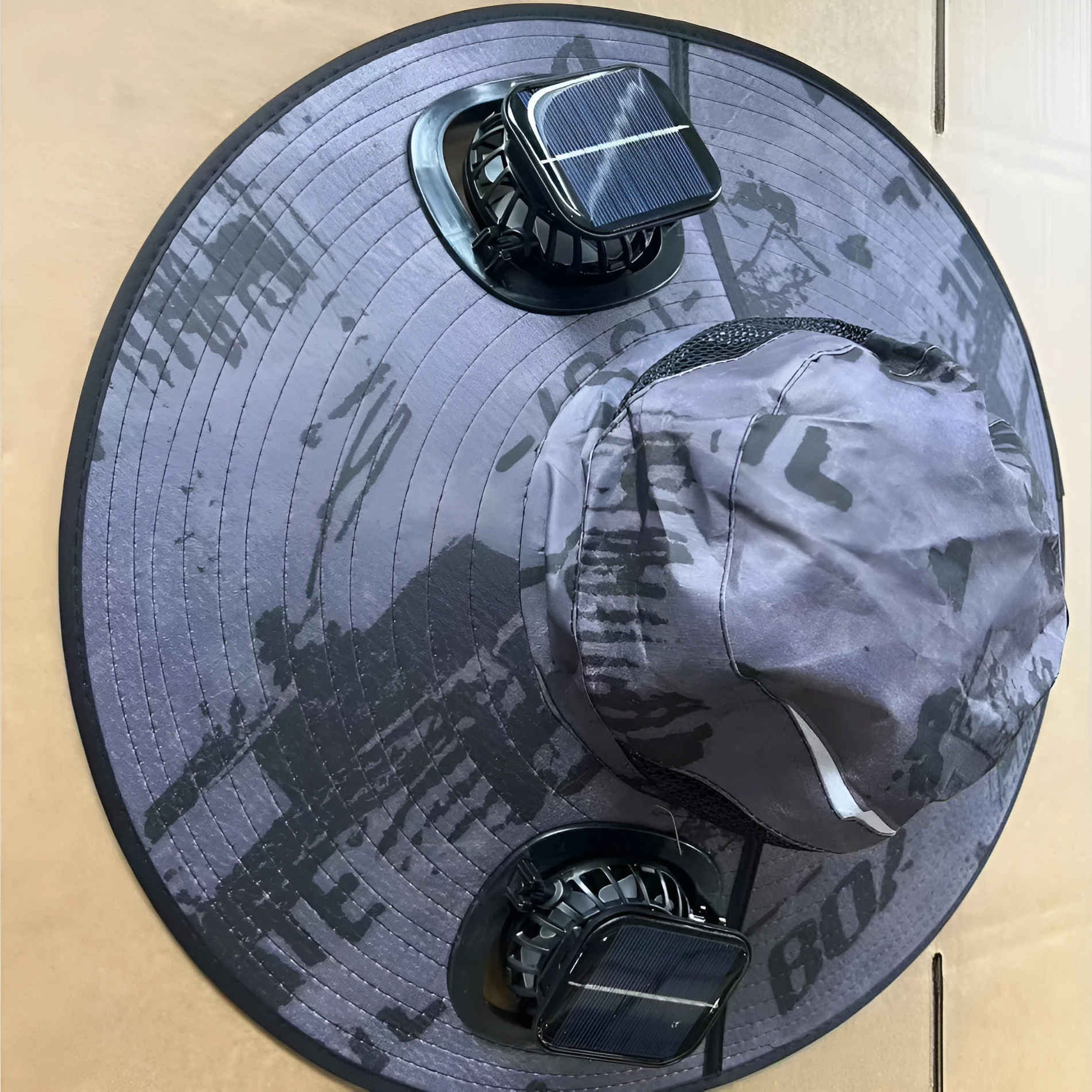 Men's grey solar fan cap with large shading eave and integrated cooling fan on brim.