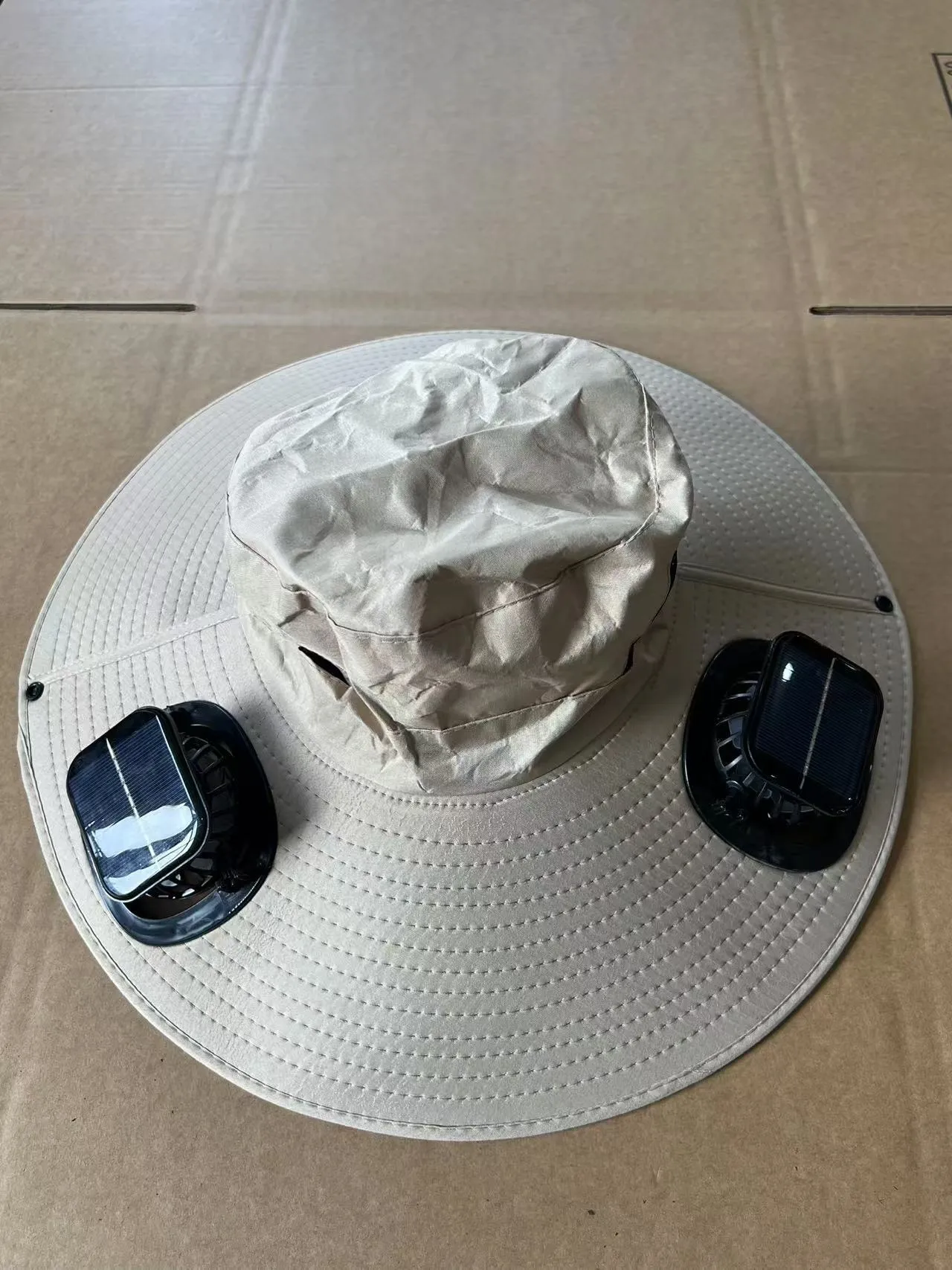 Men's grey solar fan cap with large shading eave and integrated cooling fan on brim.