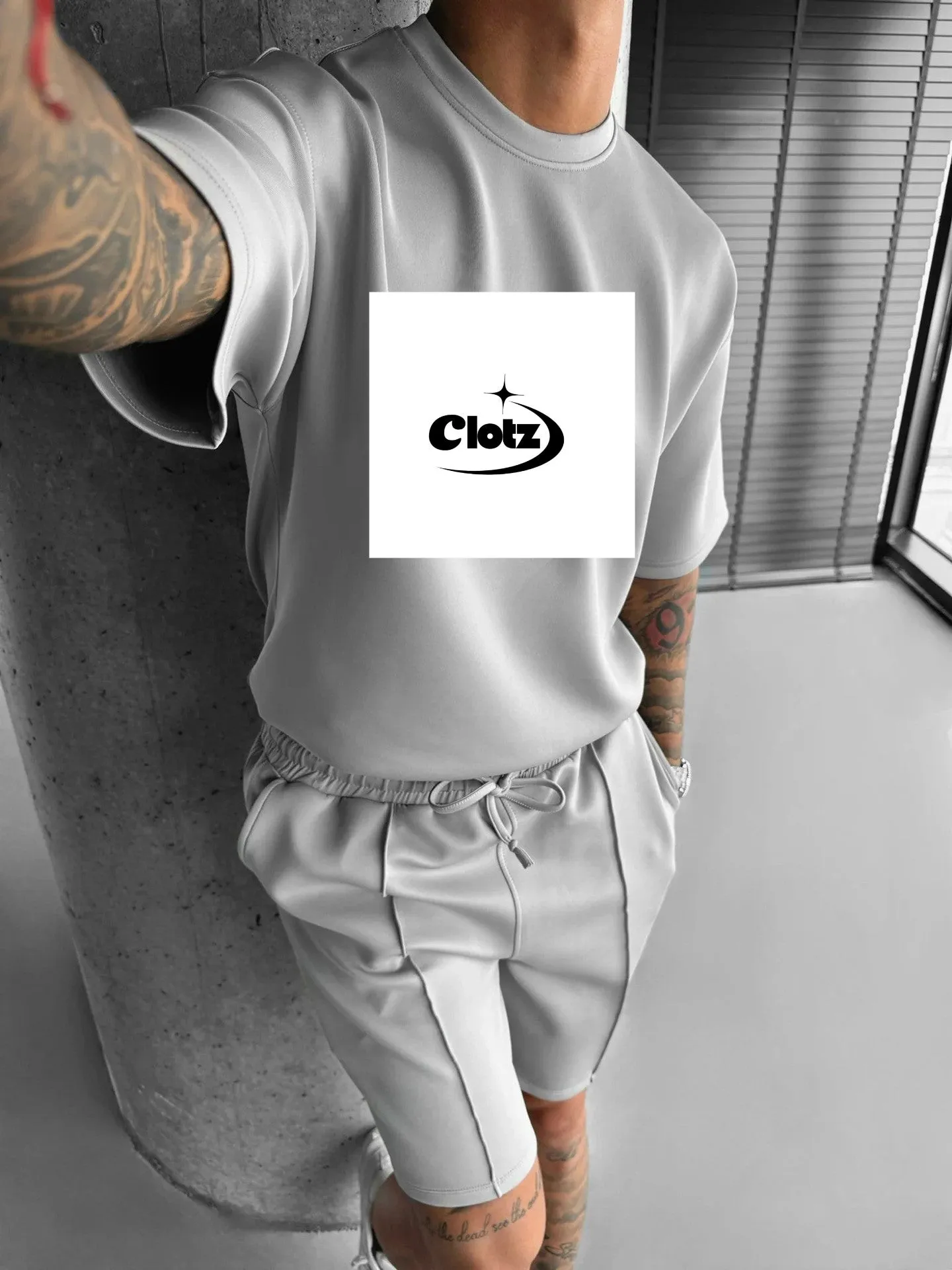Men's 100% polyester fitness and leisure suit set in khaki with top and pants, front view