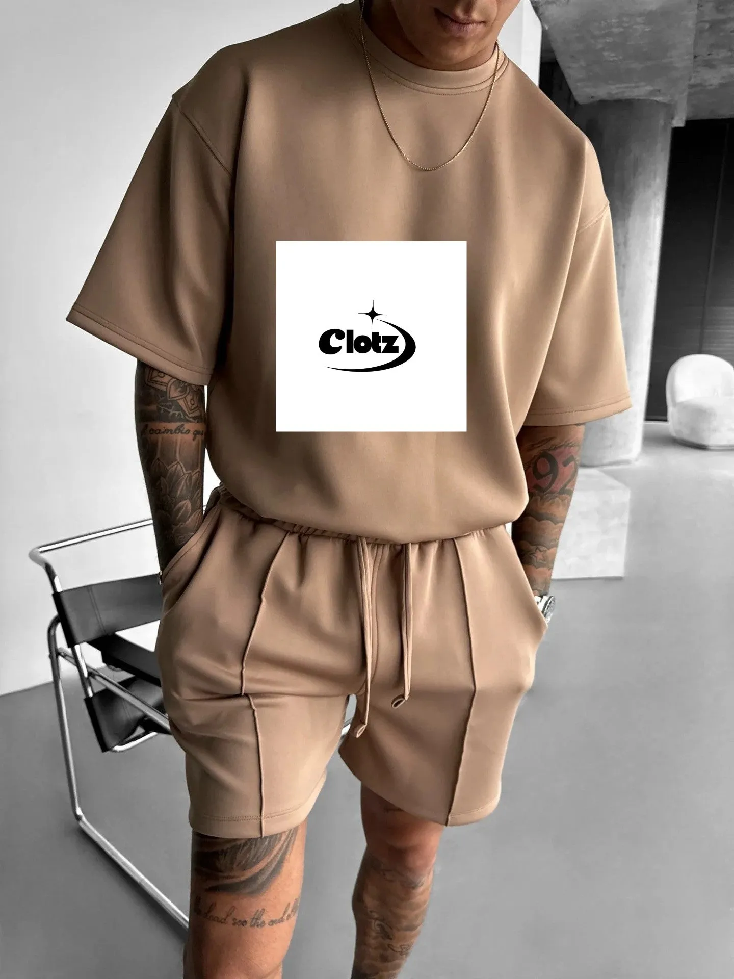 Men's 100% polyester fitness and leisure suit set in khaki with top and pants, front view