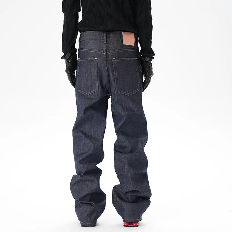 Man wearing dark blue loose fit straight leg denim jeans.