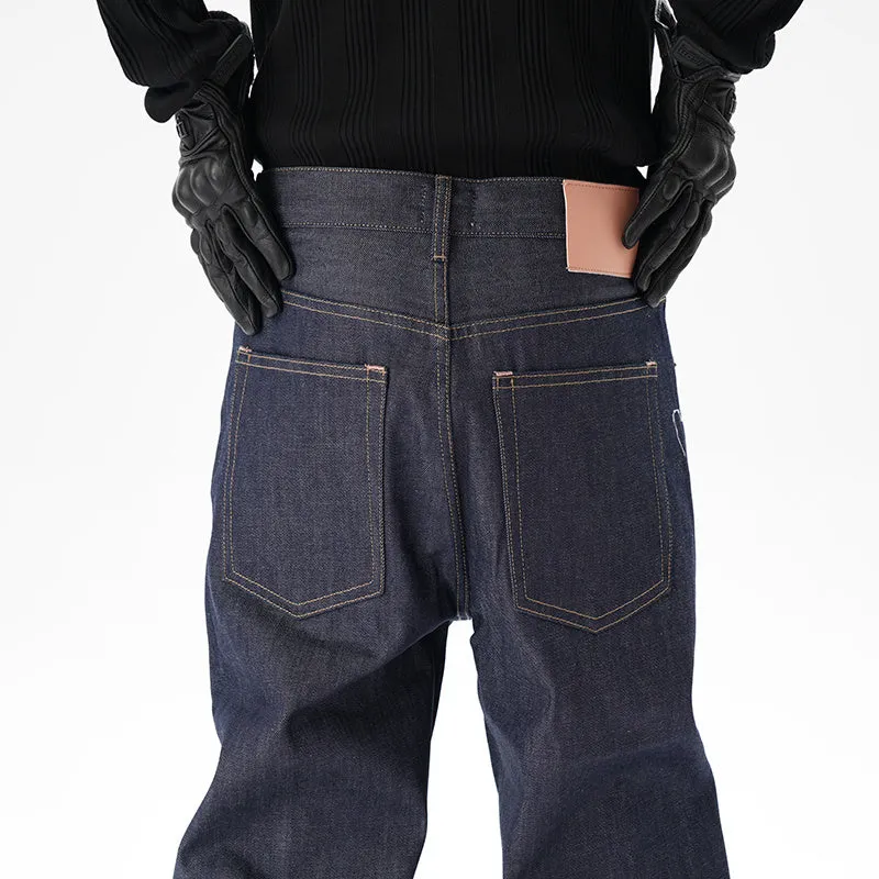 Man wearing dark blue loose fit straight leg denim jeans.