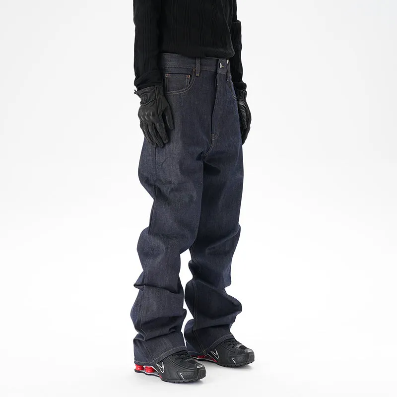 Man wearing dark blue loose fit straight leg denim jeans.