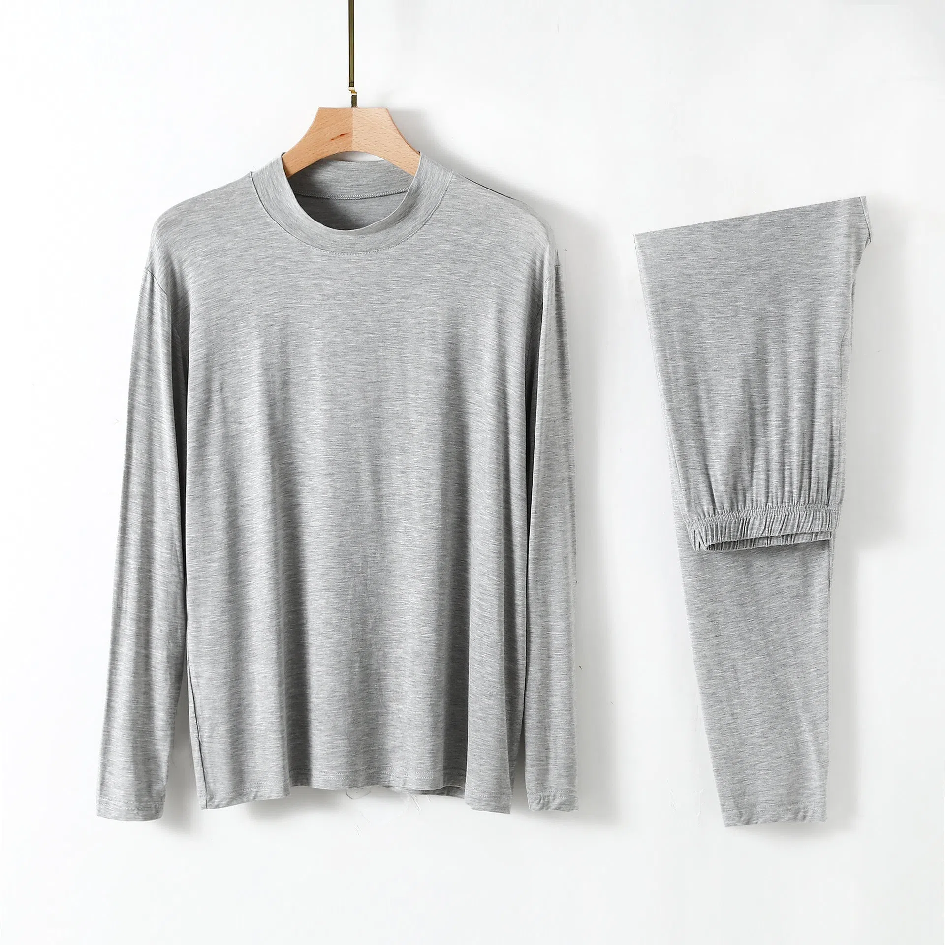 Men's modal pyjama set with semi-high neck and long pants in black, front view on model