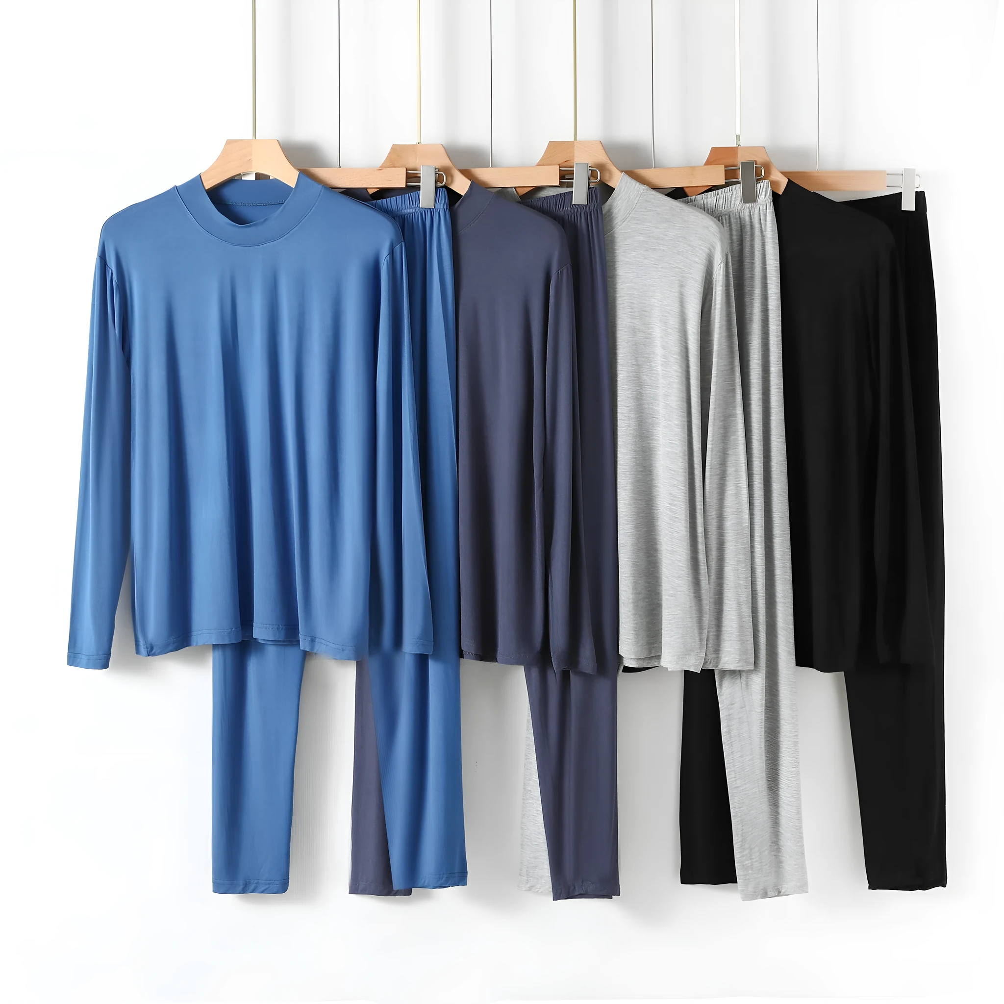 Men's modal pyjama set with semi-high neck and long pants in black, front view on model