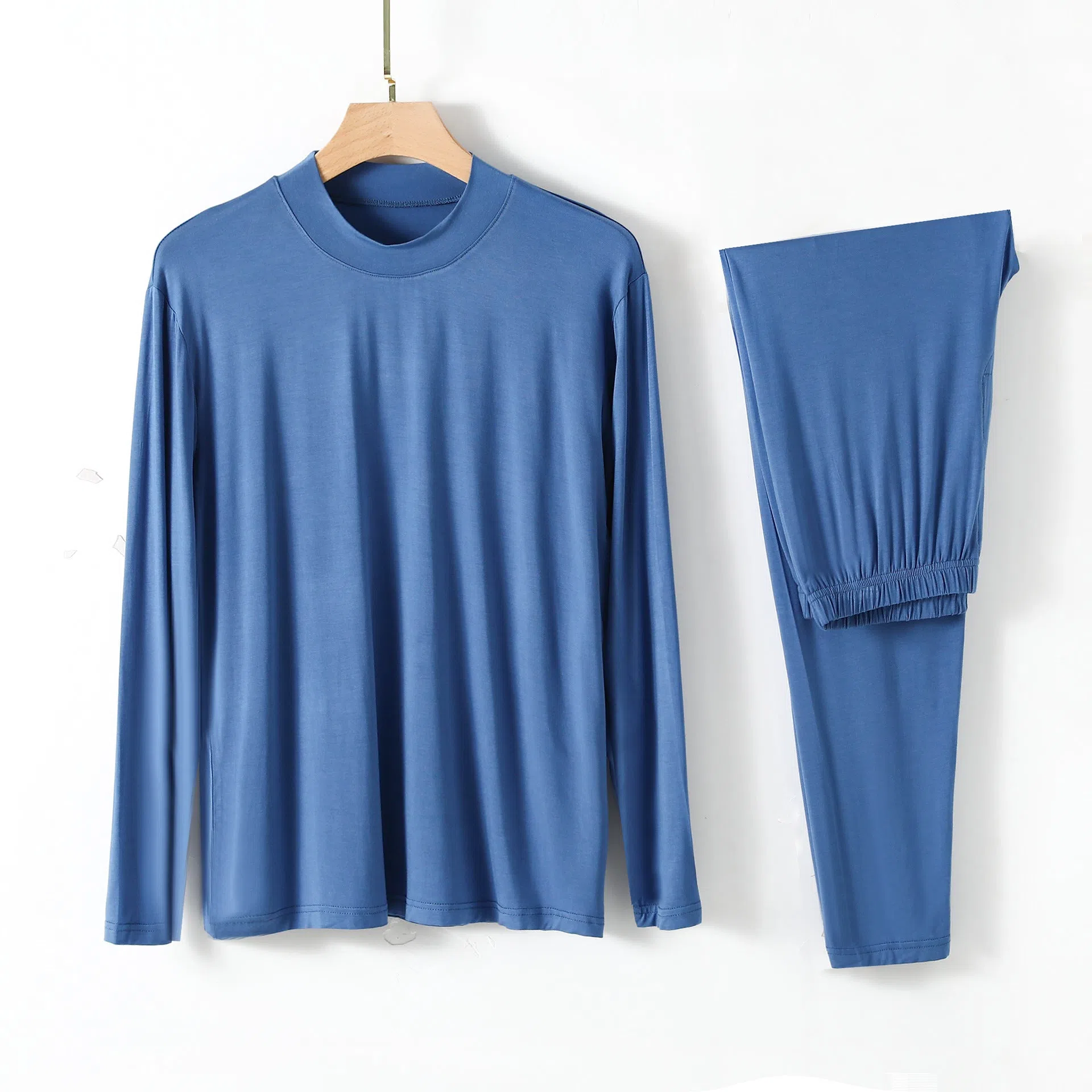 Men's modal pyjama set with semi-high neck and long pants in black, front view on model