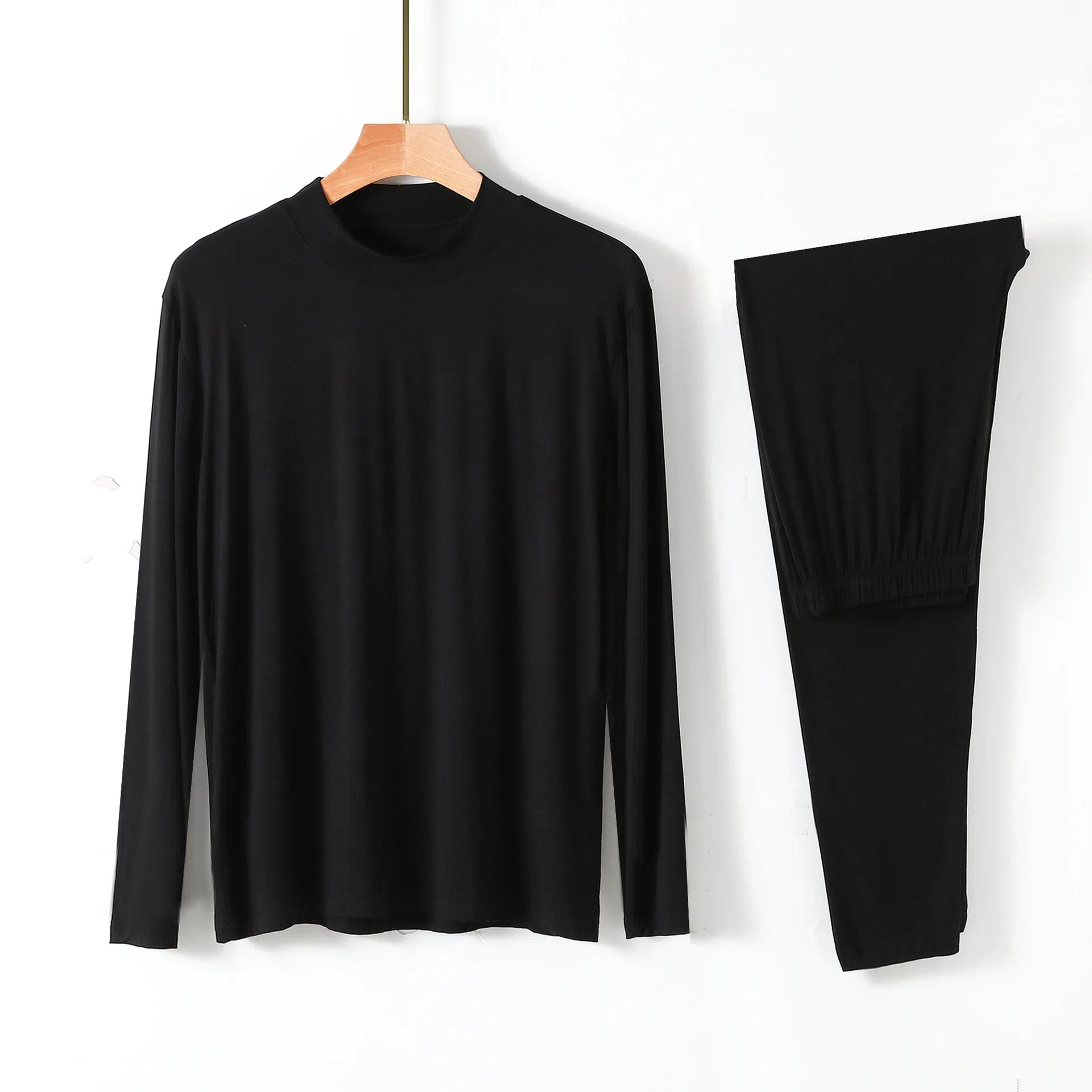 Men's modal pyjama set with semi-high neck and long pants in black, front view on model
