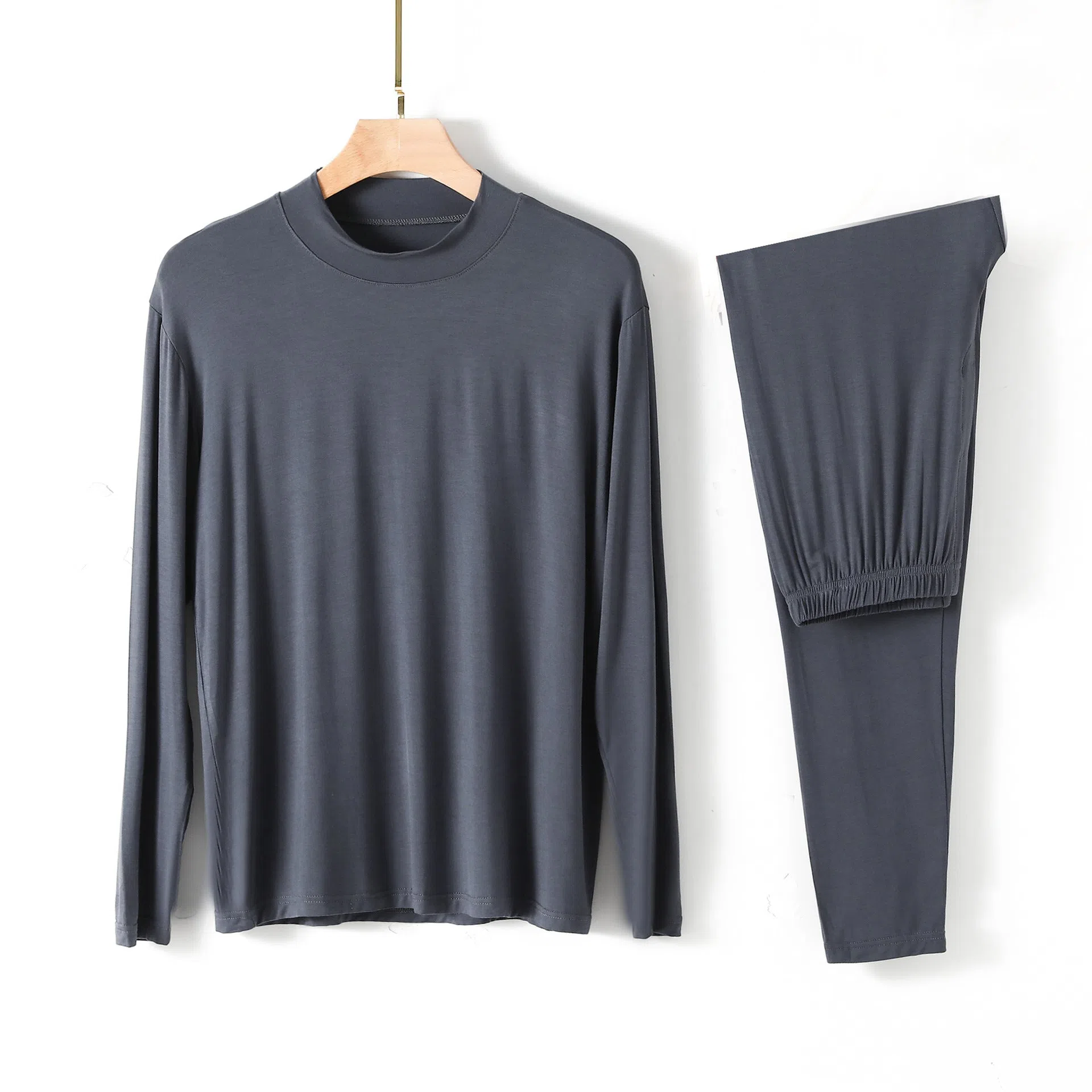 Men's modal pyjama set with semi-high neck and long pants in black, front view on model