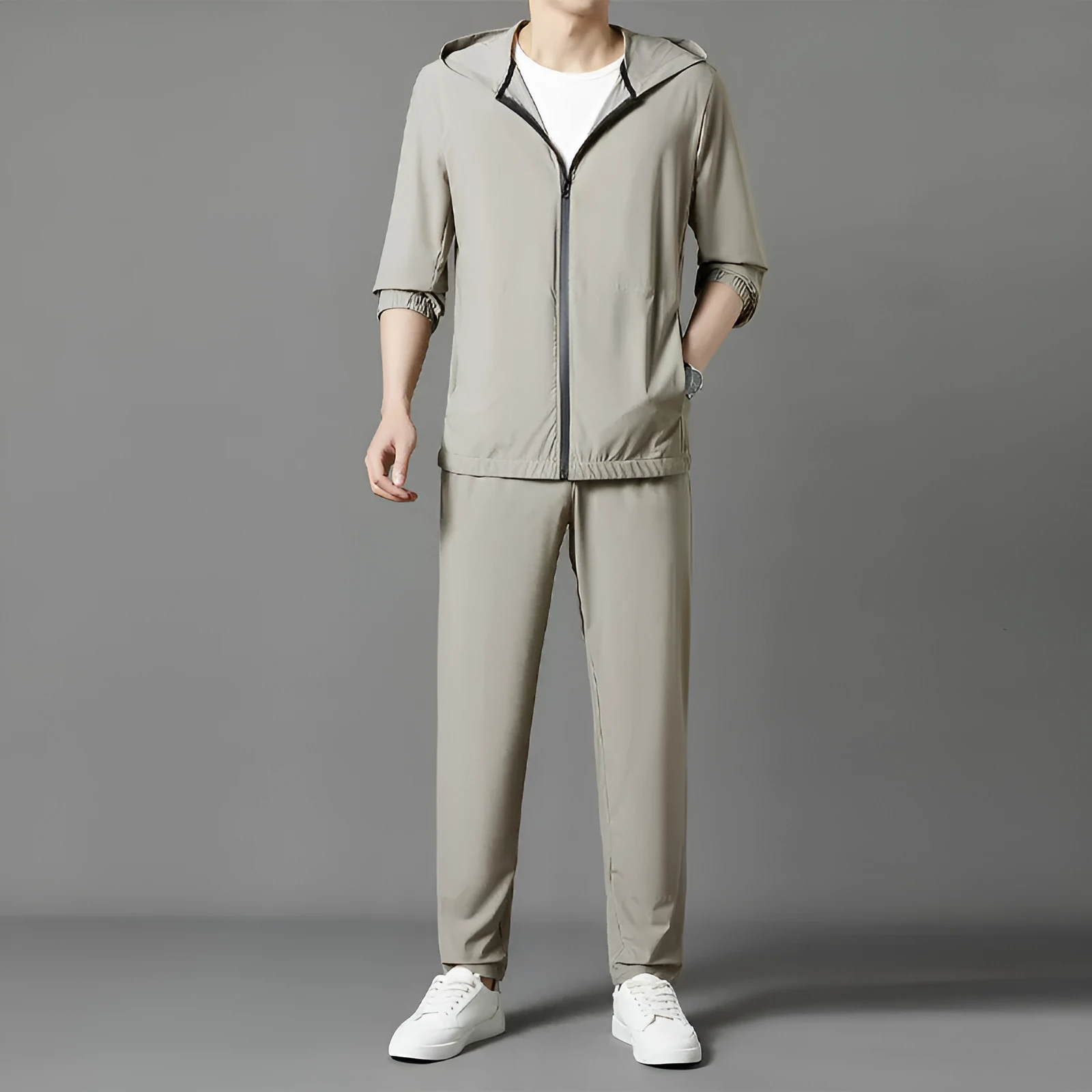 Grey hooded sun-protective top and trousers casual set laid flat showing loose fit and pocket detail