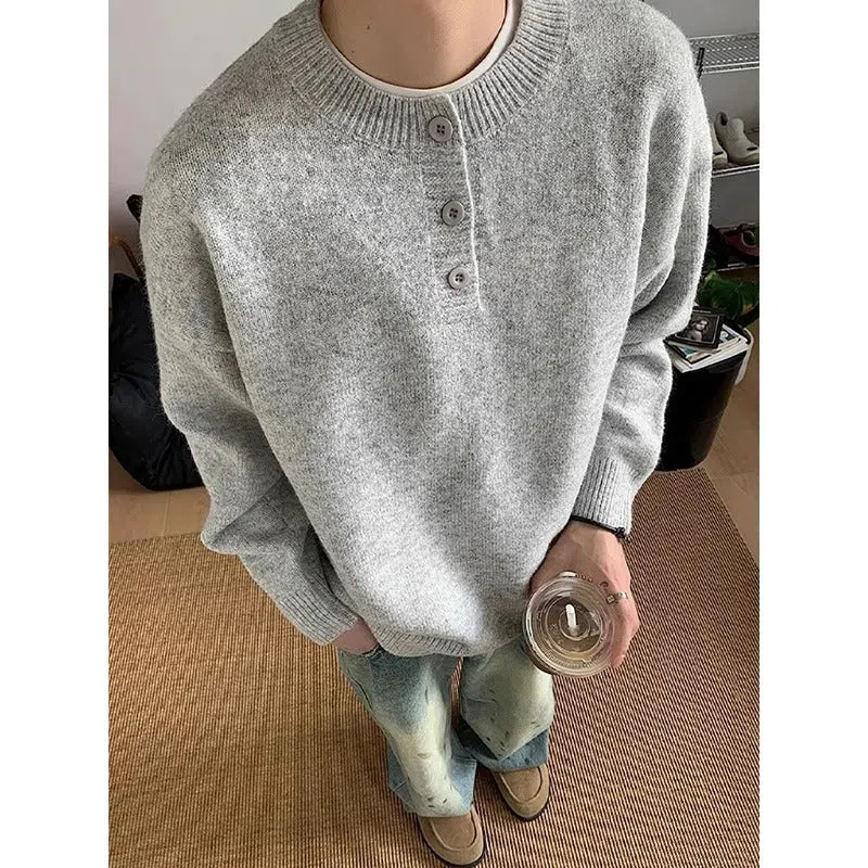 Men's loose Hong Kong style long sleeve polyester knit sweater in black, front view on model