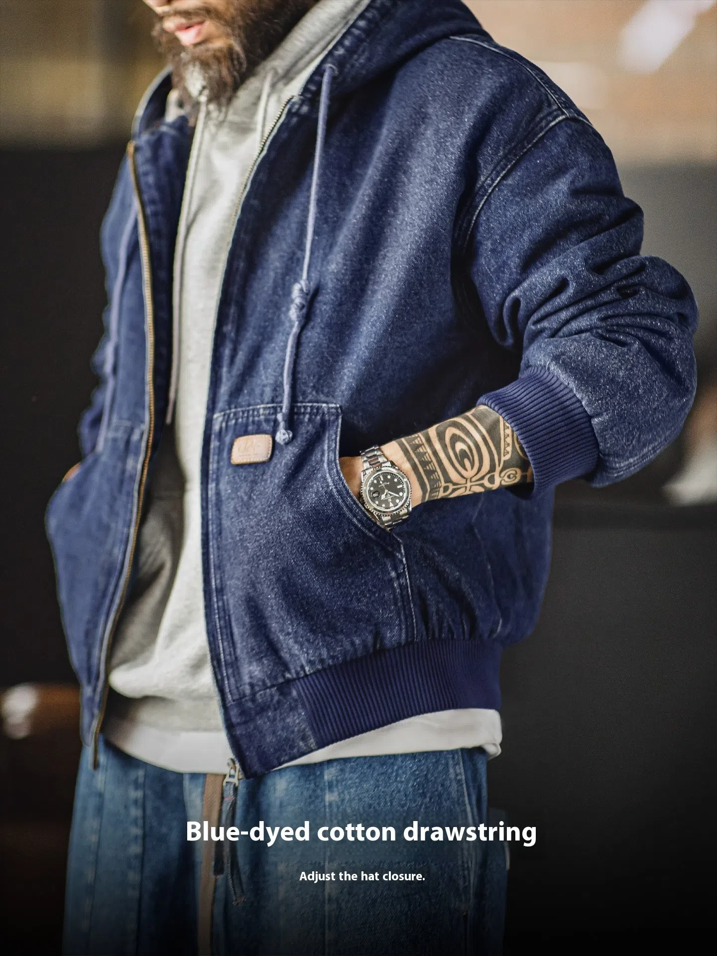 Blue tooling American retro washed denim jacket with hood and zipper front on hanger