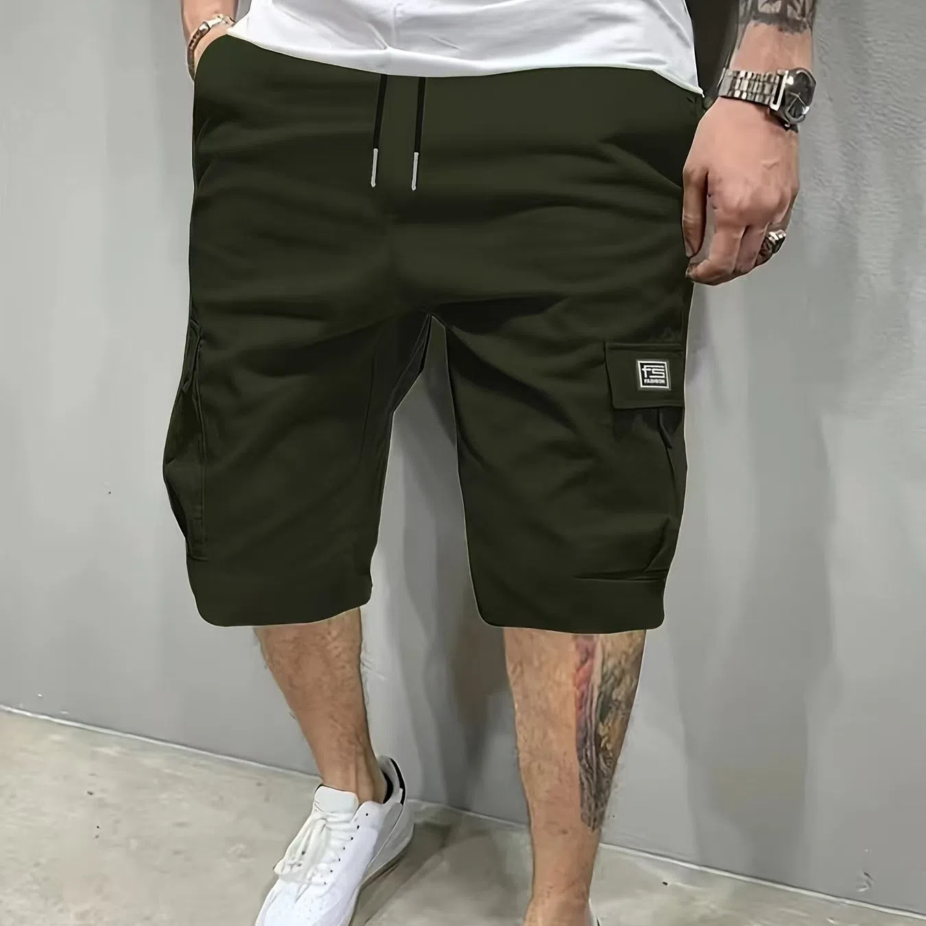Men's polyester straight-leg shorts in black showing side pocket and waistband detail
