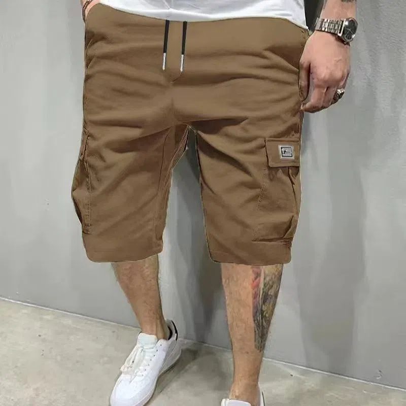 Men's polyester straight-leg shorts in black showing side pocket and waistband detail