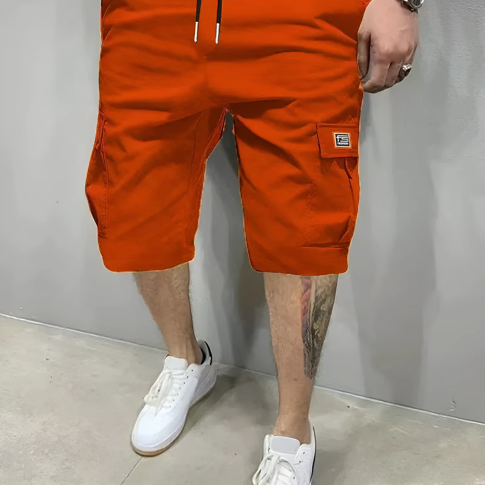 Men's polyester straight-leg shorts in black showing side pocket and waistband detail