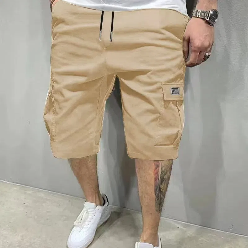 Men's polyester straight-leg shorts in black showing side pocket and waistband detail