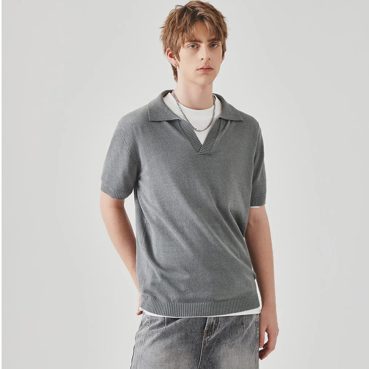 Short-sleeved polo collar casual t-shirt in solid colour on a hanger.