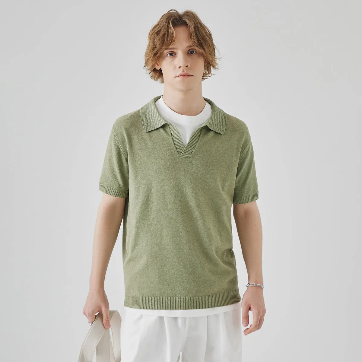 Short-sleeved polo collar casual t-shirt in solid colour on a hanger.