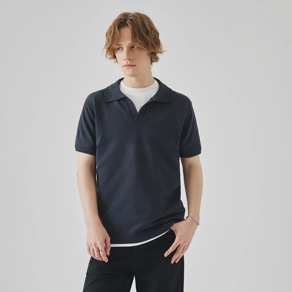 Short-sleeved polo collar casual t-shirt in solid colour on a hanger.