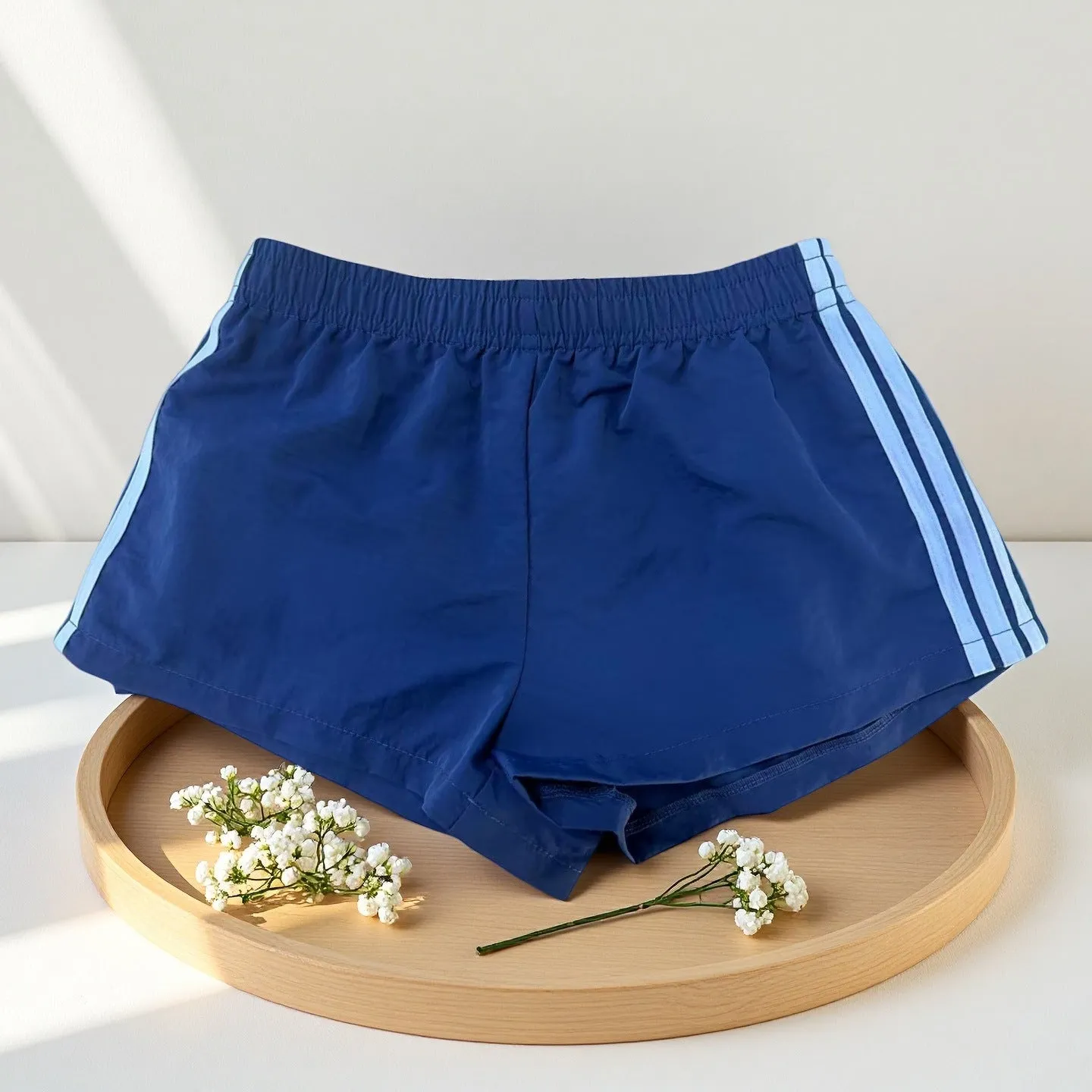 Navy blue men's nylon sport shorts with high-waist elastic waistband