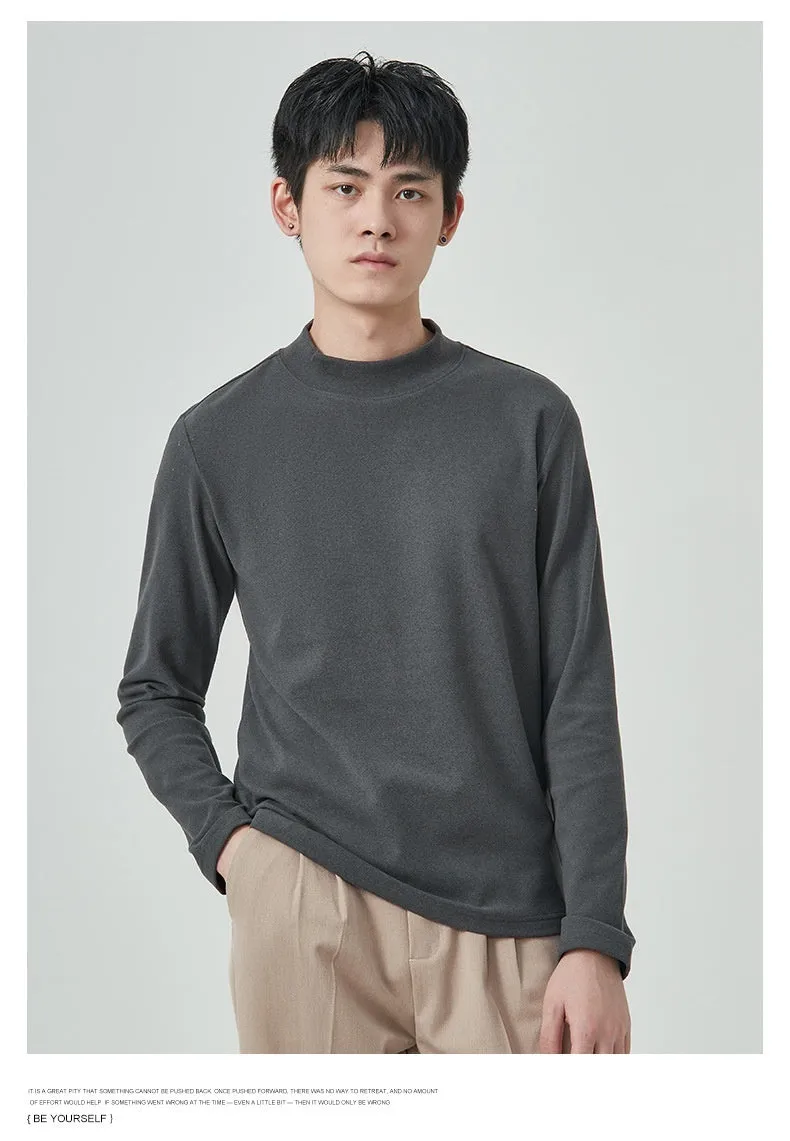 Men's solid colour half-high collar long sleeve t-shirt in Dralon fabric on a hanger.