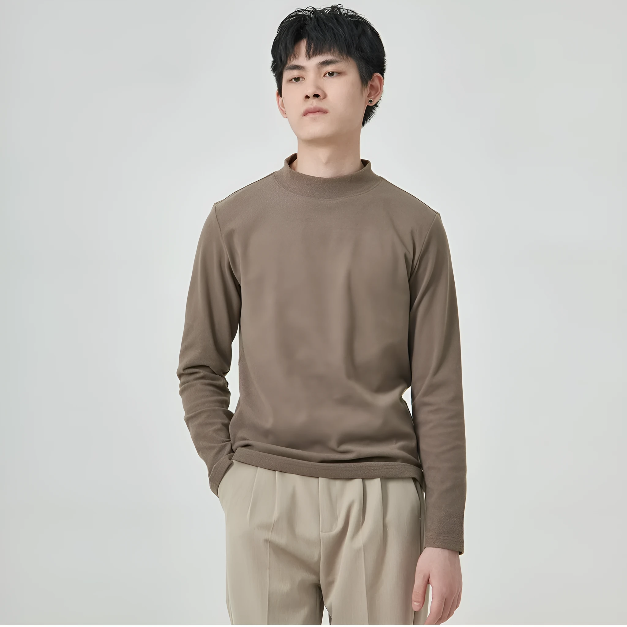 Men's solid colour half-high collar long sleeve t-shirt in Dralon fabric on a hanger.