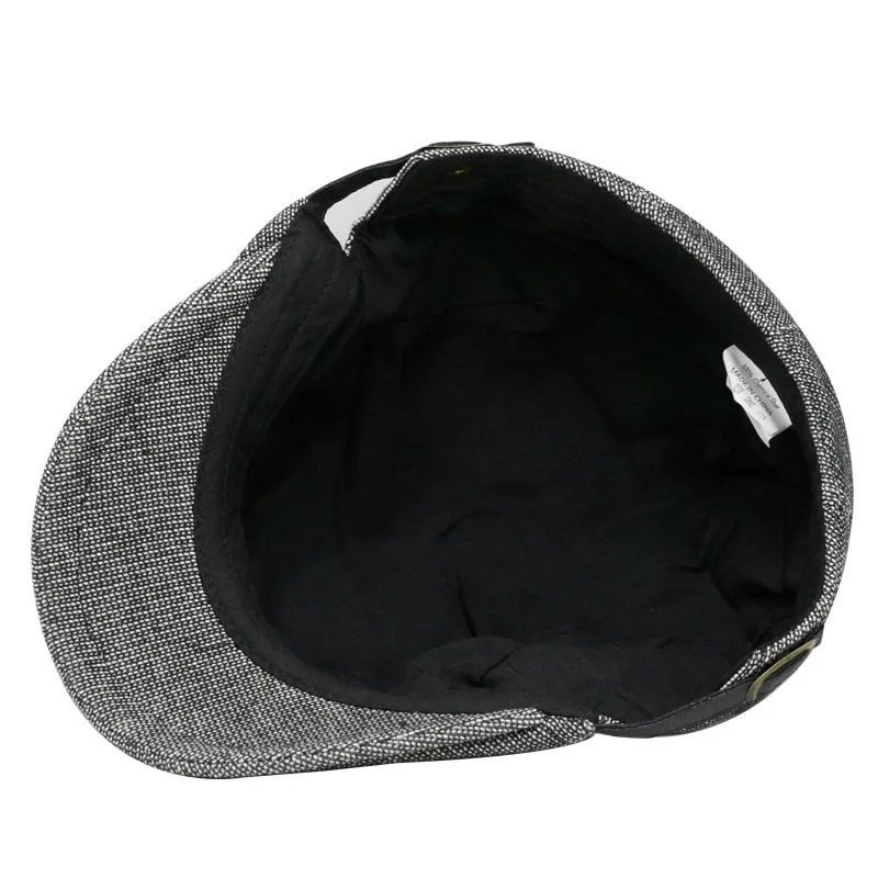 Men's cotton linen blend beret hat in black on a model, showing dome crown style.