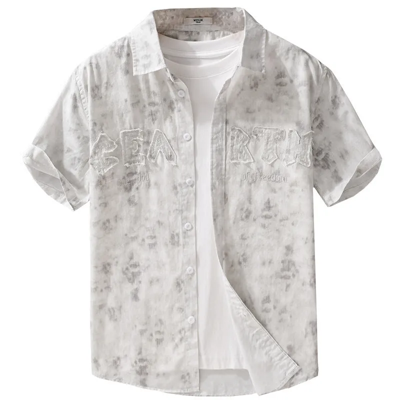 Men's grey white loose fit short sleeve cotton cardigan with a hanging dyed print, shown on a hanger.
