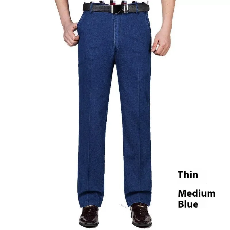 Men's loose fit high waist blue denim jeans on a plain background.