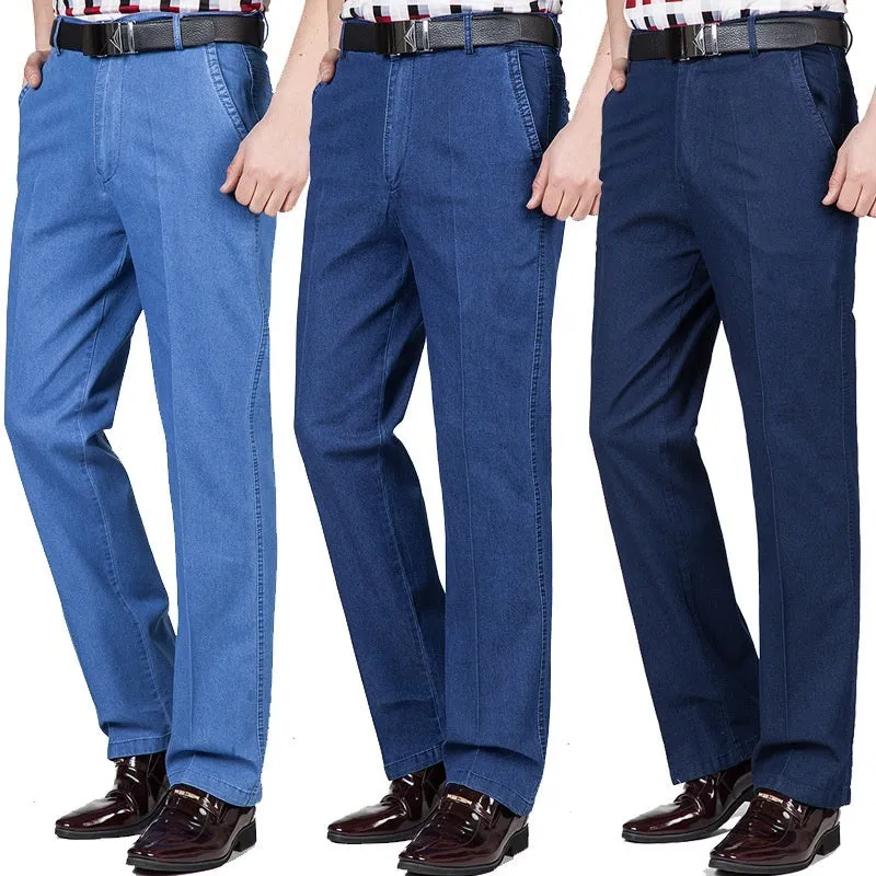 Men's loose fit high waist blue denim jeans on a plain background.