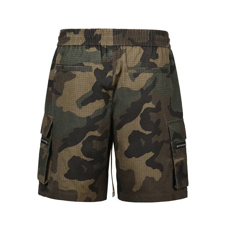 Man's green H215 camouflage cotton work shorts with multiple pockets shown in a loose fit.