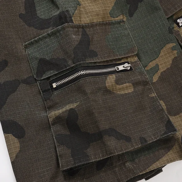 Man's green H215 camouflage cotton work shorts with multiple pockets shown in a loose fit.