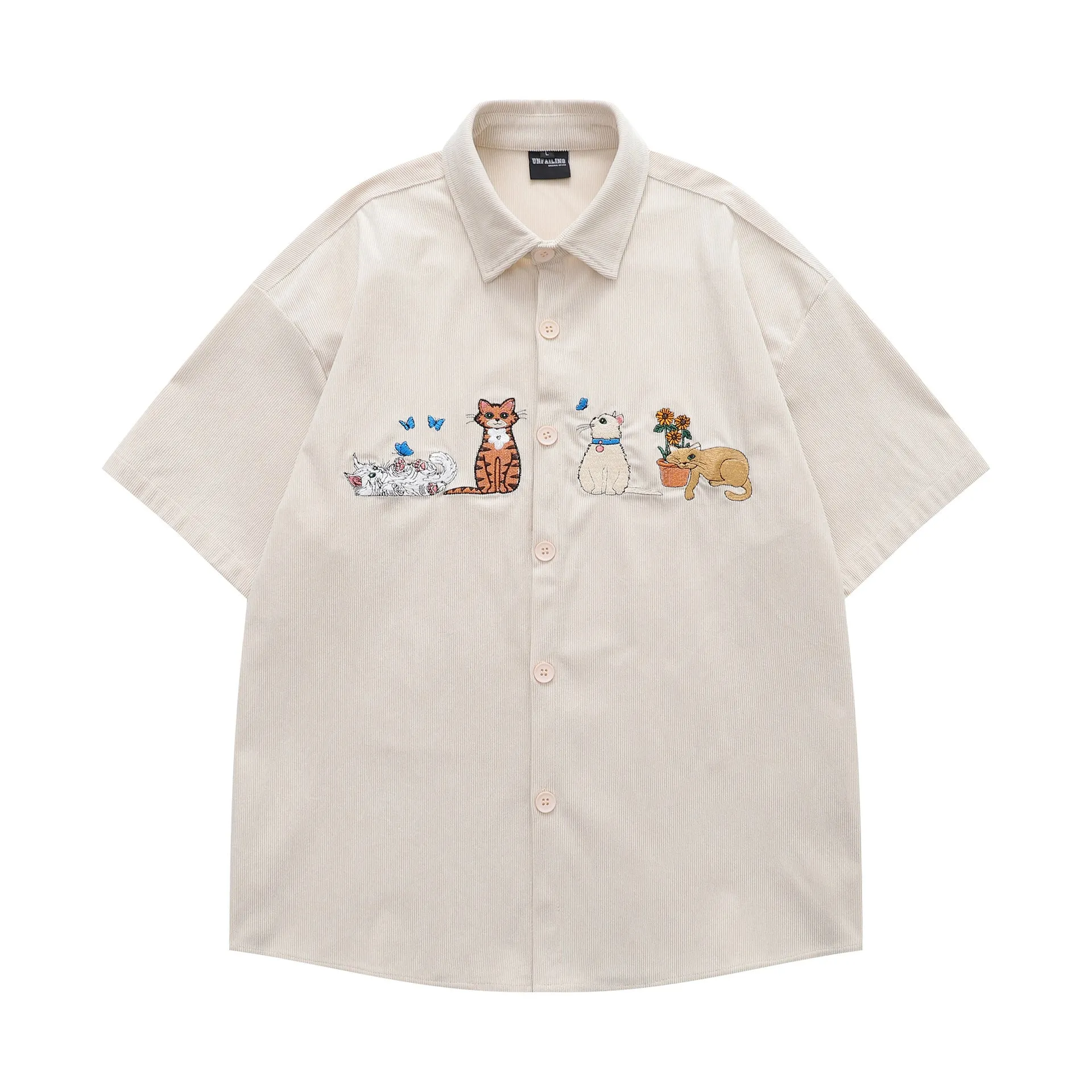 Loose apricot cardigan shirt with cartoon embroidery detail on the front