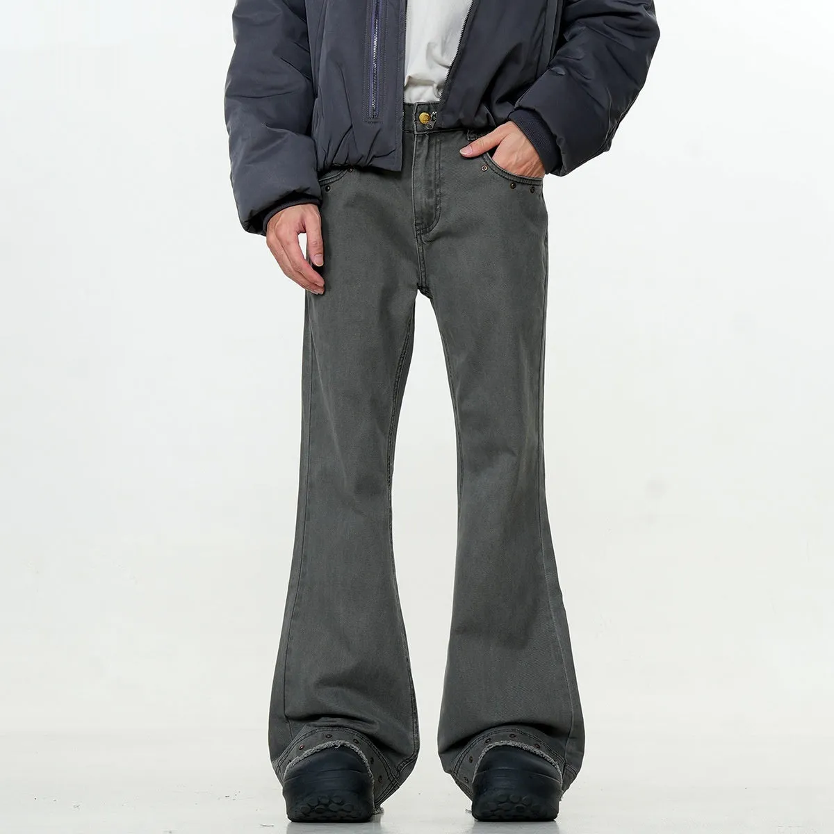 Straight-leg cotton jeans on a hanger, showing mid-waist fit, zipper fly, and horn-style leg opening.