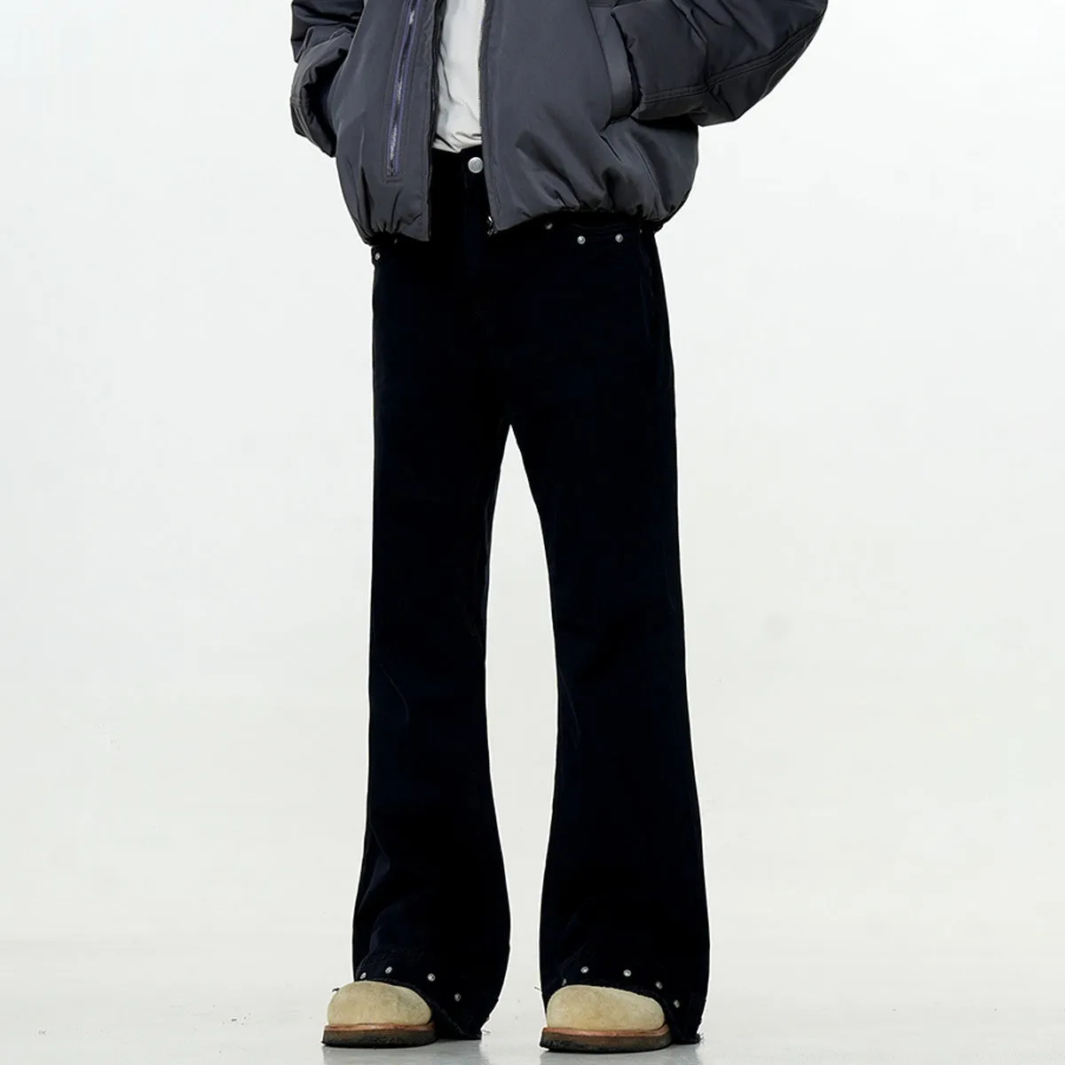 Straight-leg cotton jeans on a hanger, showing mid-waist fit, zipper fly, and horn-style leg opening.