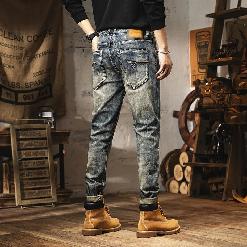 Man wearing vintage blue loose-fit jeans with a fleece lining and drawstring waist.
