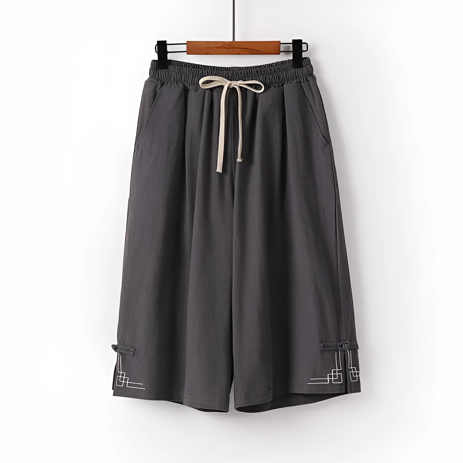 Women's wide leg linen leisure shorts in apricot colour with embroidery detail.